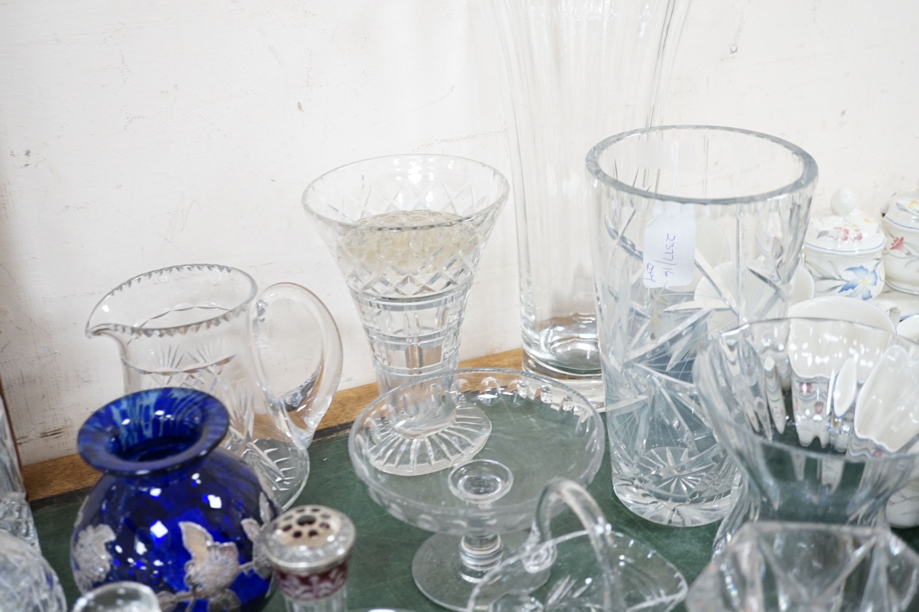 A quantity of cut crystal and other glassware to include decanters, vases, bowls etc